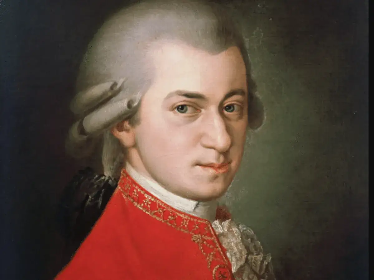 Portret Mozarta w czerwonym stroju. Zastanawiasz się, ile lat żył Mozart? Miał zaledwie 35 lat.